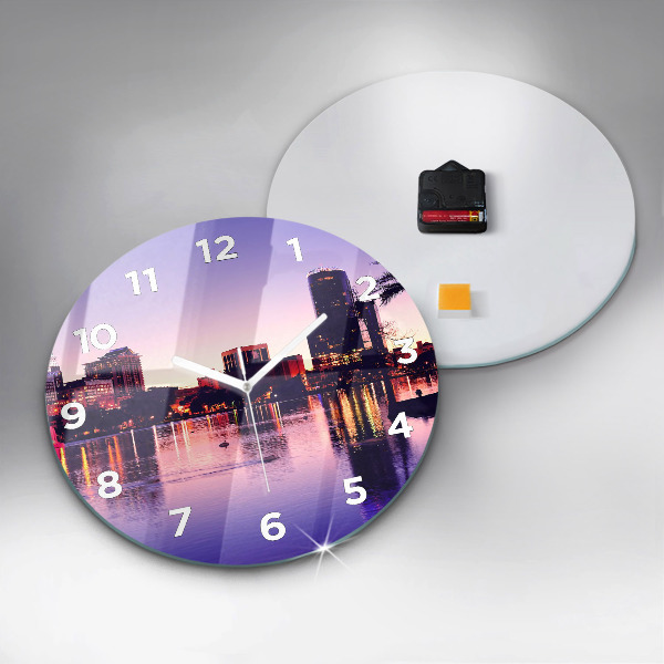 Round glass clock Evening panorama of the city