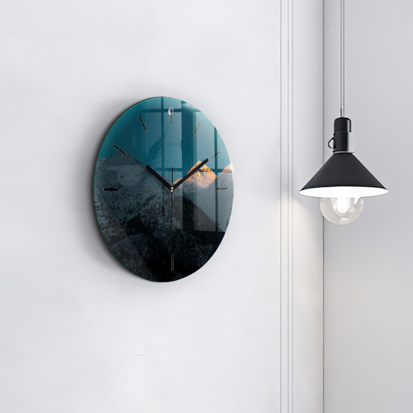 Round glass clock Sunset in the mountains