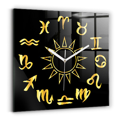 Square glass clock Golden astrological signs on black background